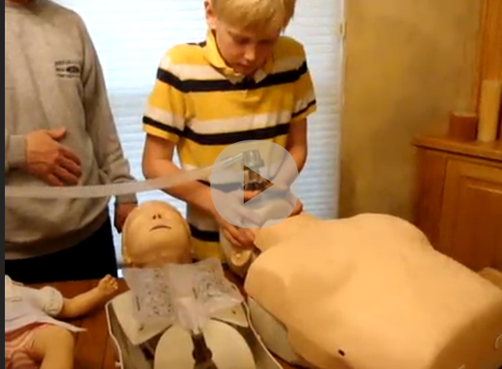 Child using AMY rescue breathing device