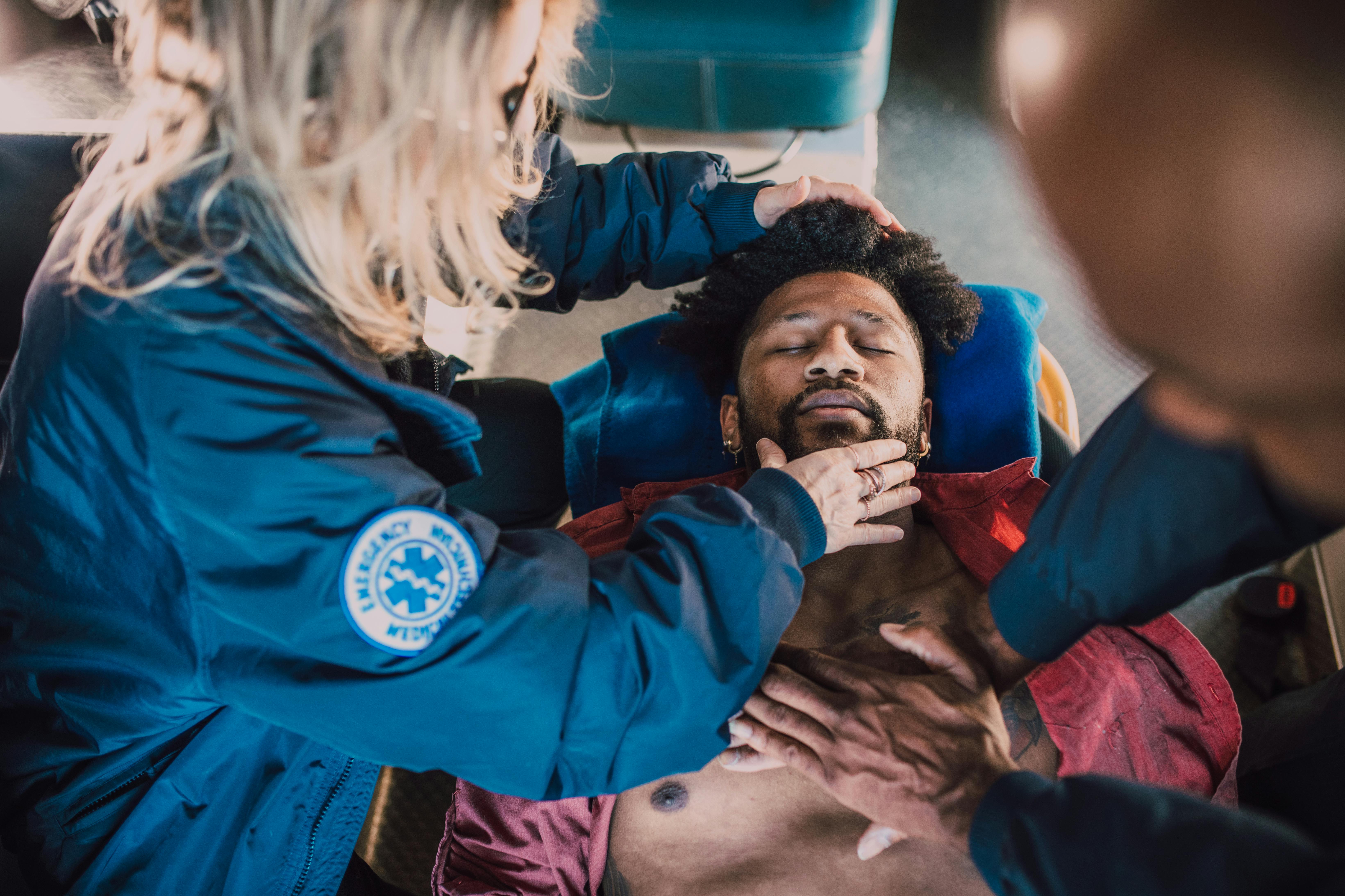 EMT performing CPR — rescue breathing challenge in the field